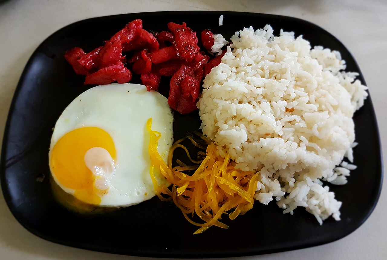 Tocilog with pork tocino, rice, a fried egg, and atchara
